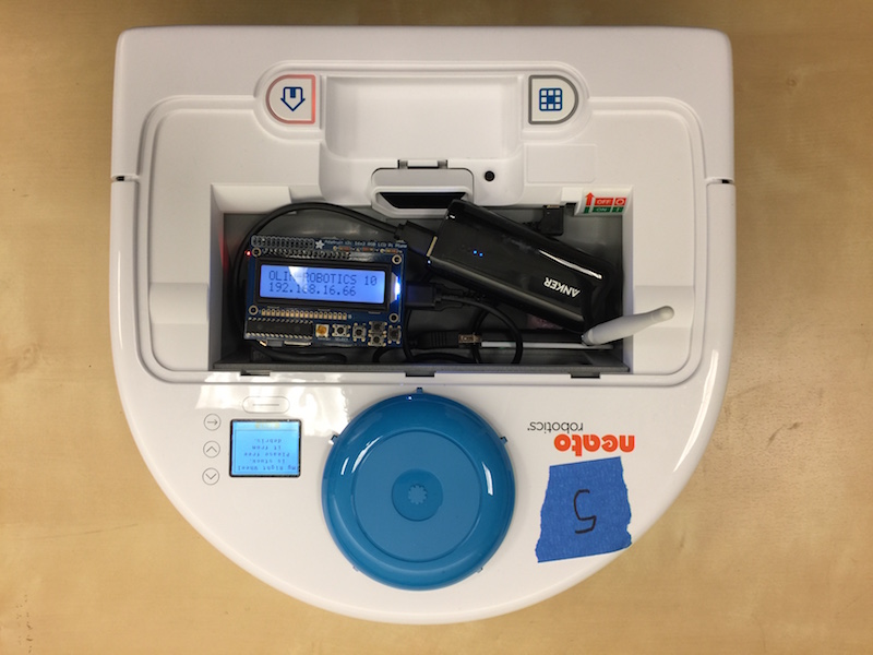 A picture of a Neato robotic vacuum with a custom remote control interface based on Raspberry Pi